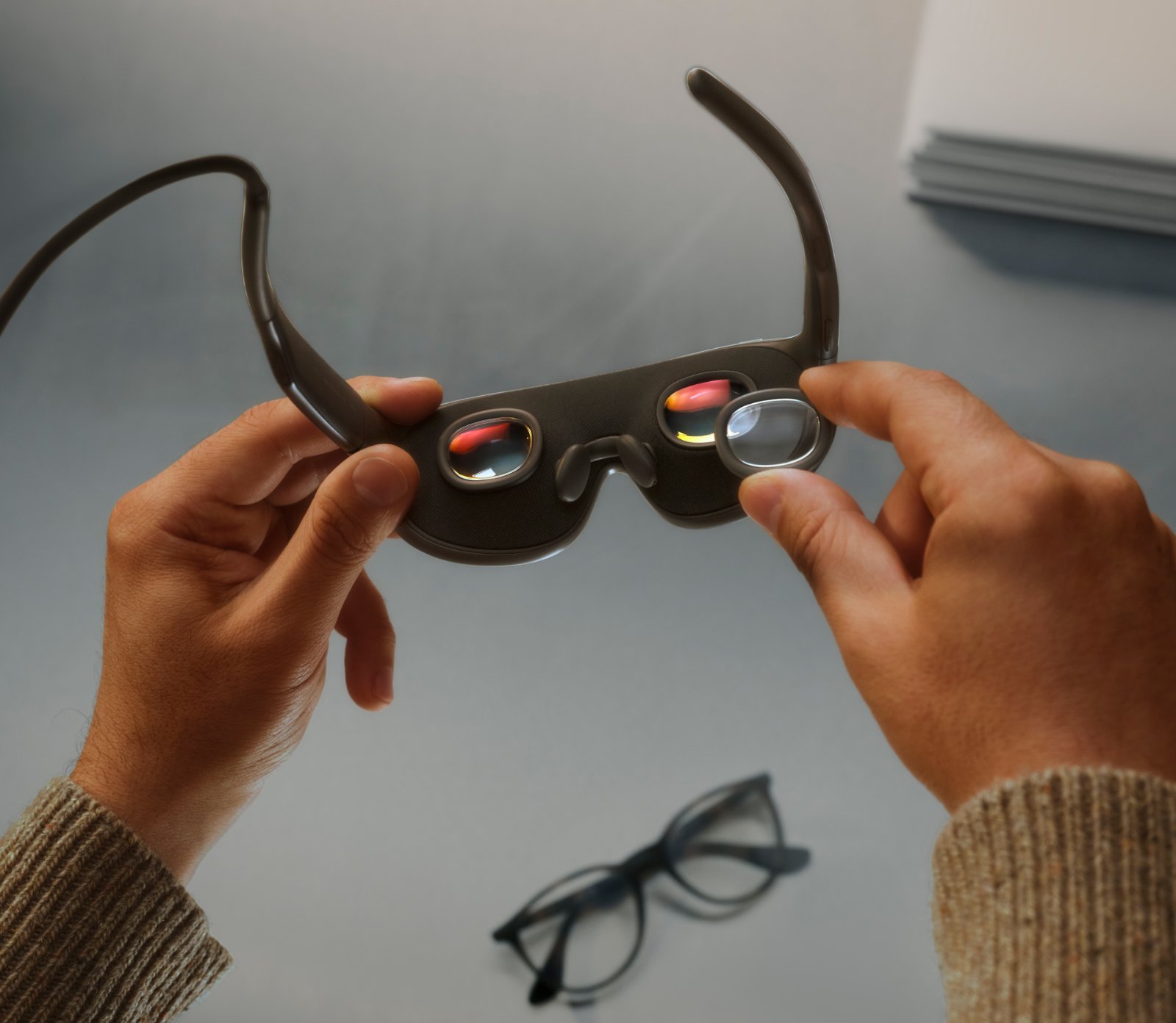 Meta VR Glasses: A 100-Gram Headset for the Next Generation of Work in VR 2 Person holding the Meta VR Glasses